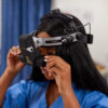 Student with Keeler Vantage Plus binocular indirect